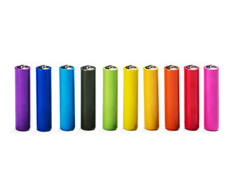 Different color alkaline batteries isolated on white background