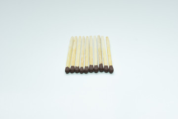 Matches over white background. Closeup shot. Shallow depth of field.