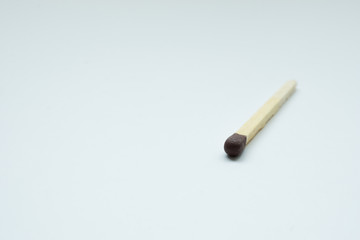 Matches over white background. Closeup shot. Shallow depth of field.