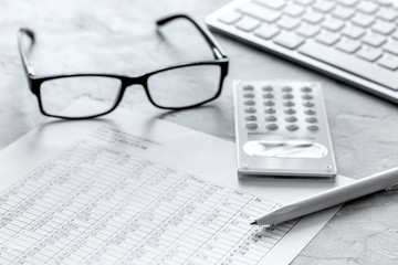 business accounter work with taxes and calculator on white office desk