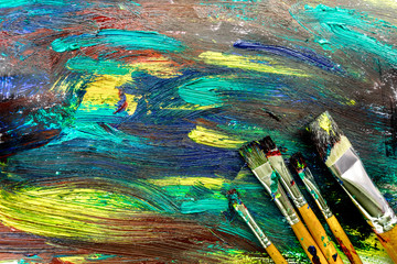 bright abstract paint drawing background top view texture with brushes