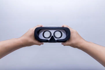 Hand holding VR glasses