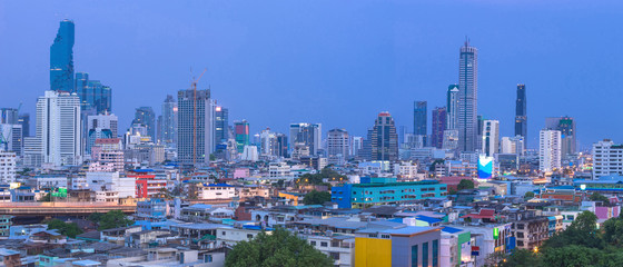 The beautiful scenery panorama of tall buildings in the capital after sunset. City growth is being compared between residential and business districts.