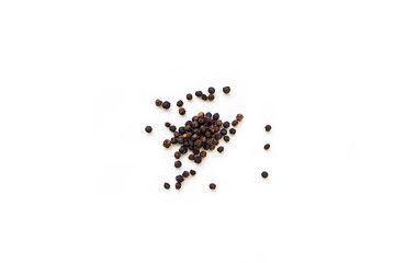 Dried whole seed of black pepper isolated on a white background seen from above