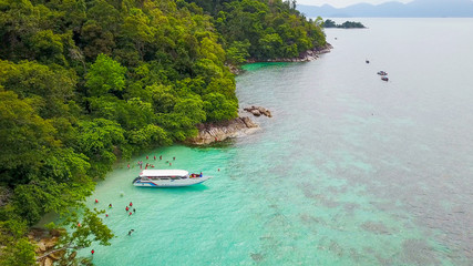 Aerial view over speed boat with beautiful sea and beach,Top view from drone, Koh Lipe island, Satun,Thailand