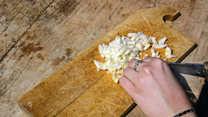 Cutting onion with a knife