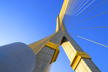 Obraz premium A rope bridge in Bangkok city and blue sky.