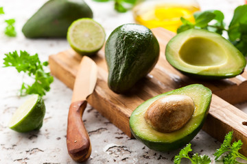 Fresh avocado on wooden board