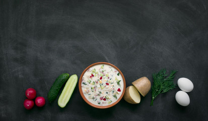 Okroshka. Traditional russian summer yoghurt cold soup with vegetables. Copy space for text
