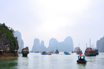 The tourist ship on foggy day, Halong Bay, Vietnam.