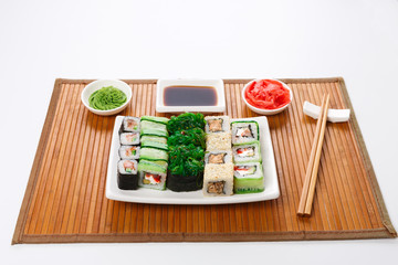 Fototapeta na wymiar Set of sushi, maki and rolls isolated on white background