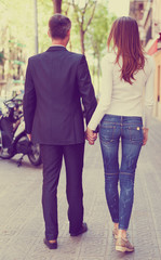 Couple spending summer time together and strolling through