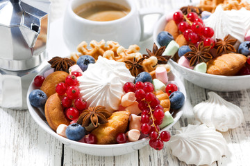 sweets, cookies and berries for breakfast, closeup