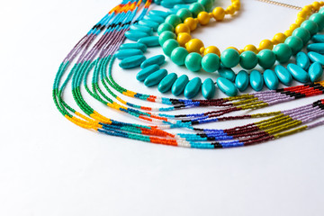 beaded necklace from colorful beads in the white background
