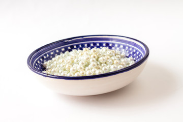 Color dish with beads, accessories for handmade jewelry. Top view