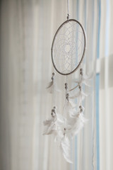 Close up of Dream Catcher on meadow background