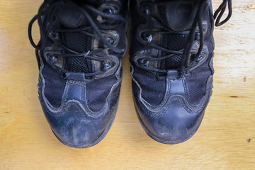 Old shoes on wooden floor