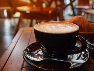 Hot coffee latte in cafe.