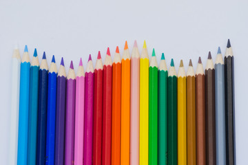 Colour pencils over white background. Shallow depth of field.