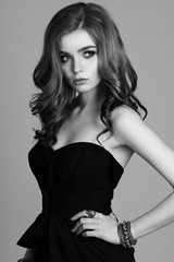 Fashion portrait of young beautiful woman with jewelry. Red hair girl. Perfect makeup. Beauty style girl with accessories