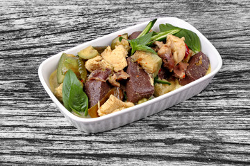 Green chicken curry in coconut milk with long eggplant .