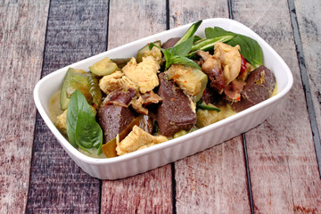 Green chicken curry in coconut milk with long eggplant .
