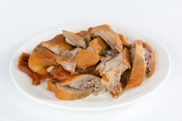 Roast duck meat on white plate isolated on white background
