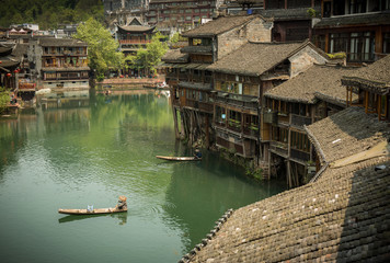fenghuang fisherman in Hunan province, China. This ancient town was added to the UNESCO World...