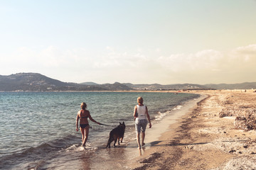 going for a walk alond the sea with the dog