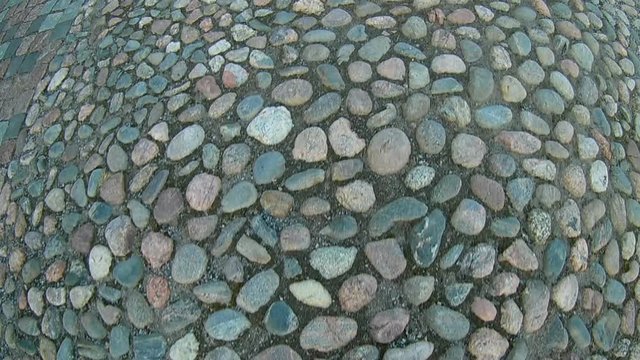 First person point of view footage of walk over pavement