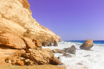 Fototapeta na wymiar Seashore Waves and Mountain under the Sunshine in Matrouh, Egypt / View of Beautiful Seashore Waves and Majestic Mountain under the Sunshine in Matrouh, Egypt
