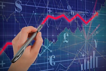 Composite image of businesswomans hand writing with pen