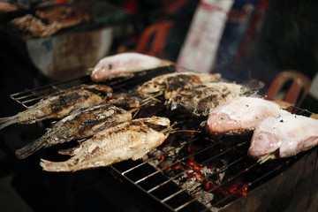 Preparing thai barbeque fish
