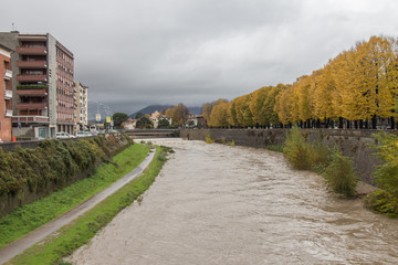 Fototapeta na wymiar View at embankment of Bisenzio River. Prato. Tuscany. Italy.