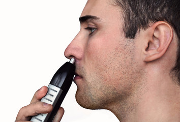 Close up man portrait with trimmer near his nose