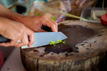 Chopping thai spring onion