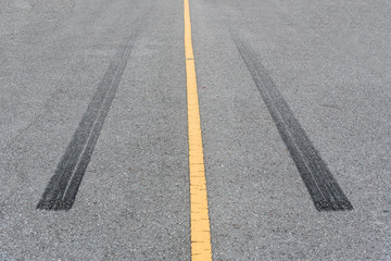 Tire tracks , Wheel trace on asphalt road.