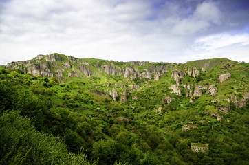 Beautiful mountain landscape, with mountain peaks covered with forest and a cloudy sky. Armenian and Georgian mountains, Caucasian mountain range