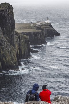 Two people admiring landscape from Nest Point, Isle of Skye, Inner Hebrides, Scotland, United Kingdom