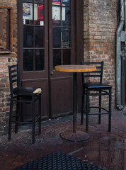 Bar Table And Two Chairs Outside Sidewalk