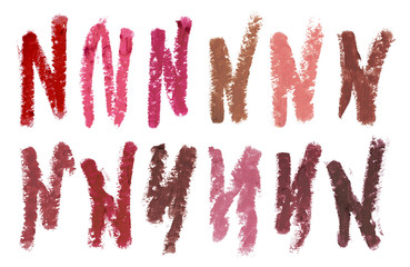 Color stroke samples of different colors and shapes of lips contour cosmetic pencils, beauty products isolated on white background