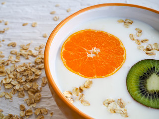 curd, muesli, cream with orange, in a Cup, space for text, healthy food, Breakfast