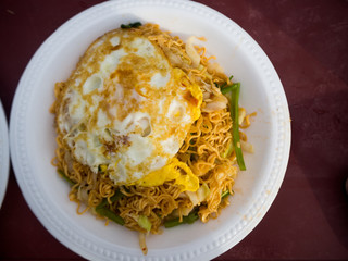 Stir fried noodle with eggs and vegetable, cambodia food.