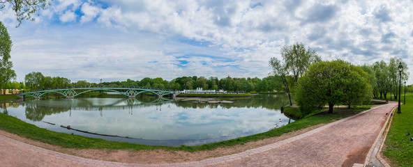 A panoramic view of the Lower pond and Western Arch Bridge in Tsaritsino park and reserve in...