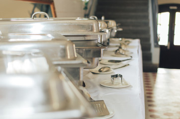 Cuisine Culinary Buffet Dinner Catering Dining Food Celebration Party Concept. Group of people in all you can eat catering buffet food indoor in luxury restaurant with meat and vegetables.