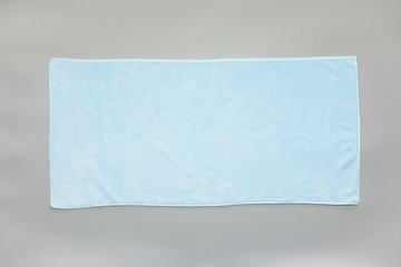 Blue towel on a gray background - 155874665