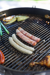 Grilled sausages on grill