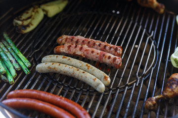 Grilled sausages on grill