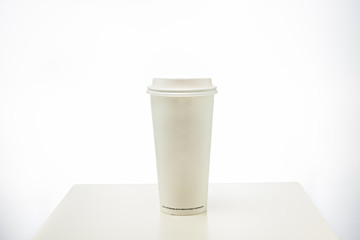 Paper coffee cup on white background