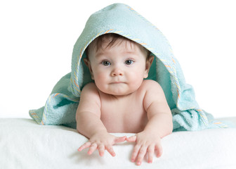 Adorable happy baby in towel